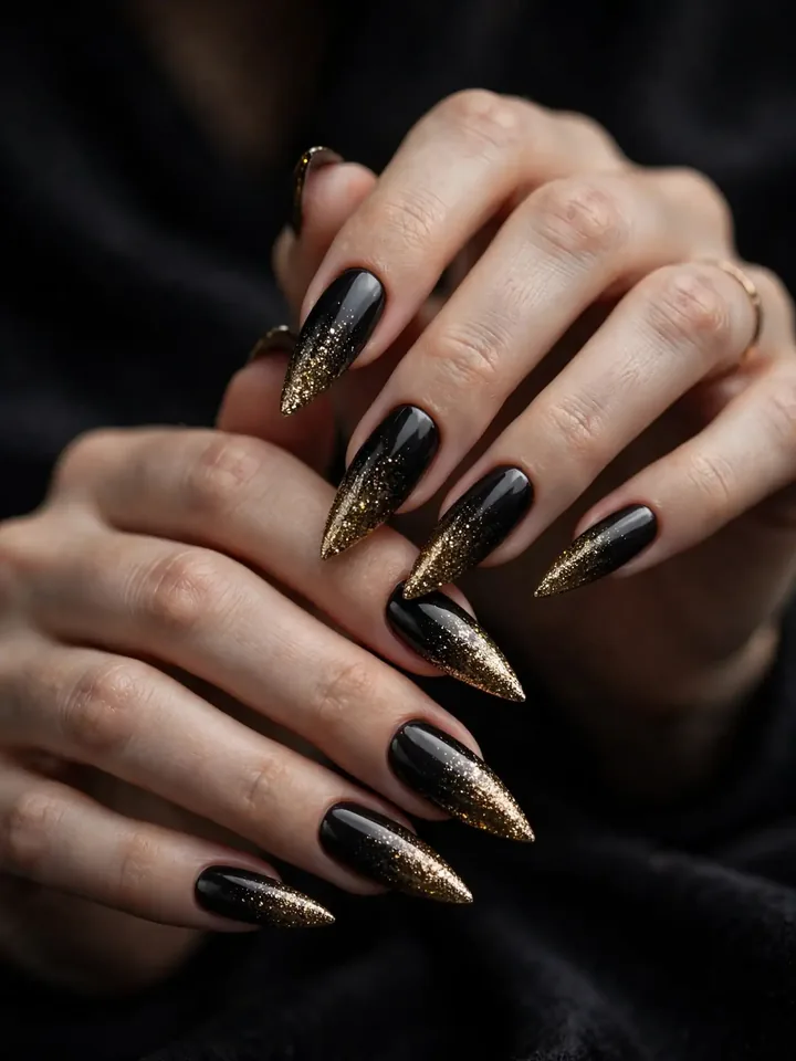 Black to gold glitter ombre black wedding nails on stiletto nails