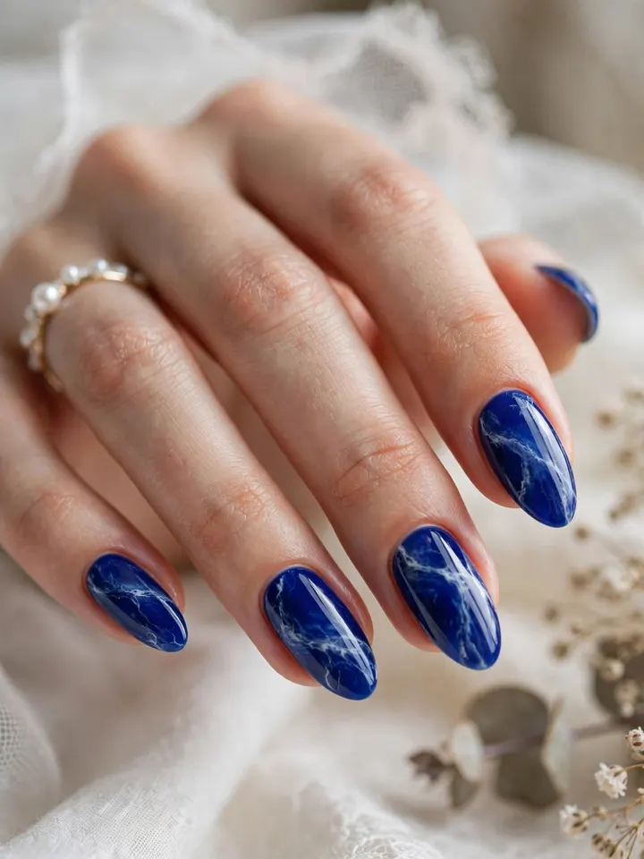 Royal blue marble blue wedding nails with white veining