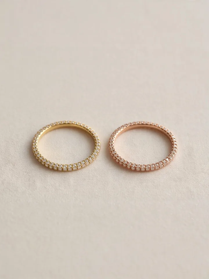 mixed metal wedding rings stack with pavé diamond eternity bands in alternating yellow gold and rose gold